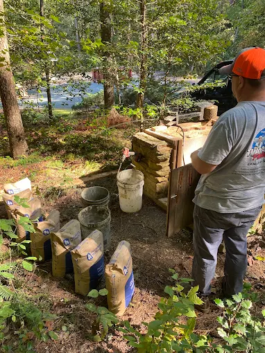 Mixing well treatment supplies by the truck at a shaded job site
