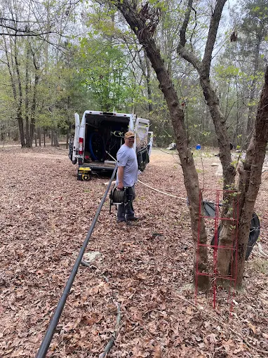 Running new water line from the van to a well in the woods