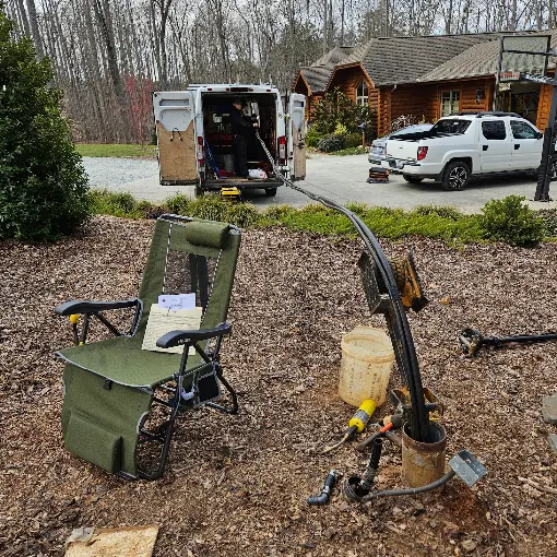 Service van set up for a pump pull at a log cabin home