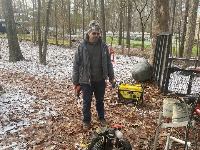 Shane on a snowy winter well job with the generator running