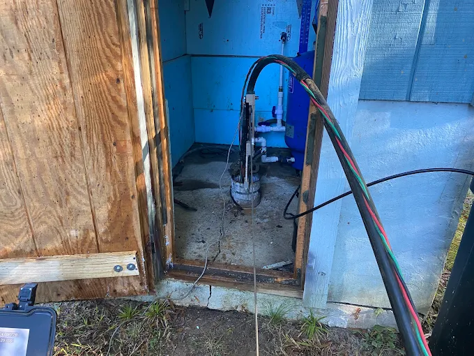 Pitless adapter, wiring and plumbing inside an insulated well house