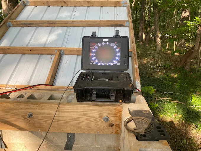 Well camera monitor set up on a well house during a downhole inspection